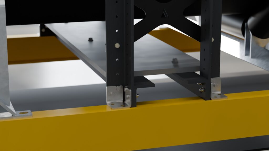 Stainless steel foot of an Accurate Industries tramp metal detector bolted to a conveyor stringer